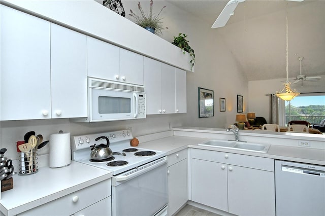 kitchen with sink, white appliances, ceiling fan, white cabinetry, and kitchen peninsula