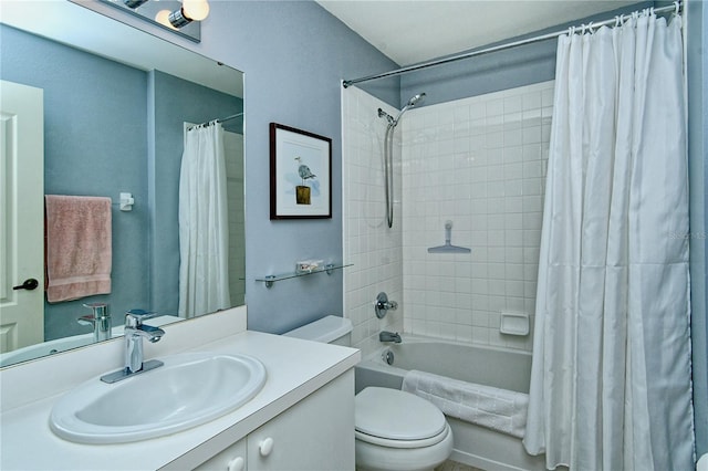 full bathroom with shower / bath combo, vanity, and toilet