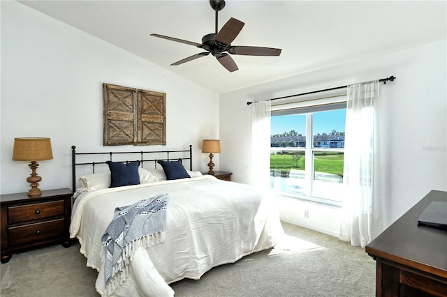 bedroom featuring lofted ceiling, carpet floors, and ceiling fan