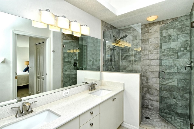 bathroom featuring vanity and a shower with door