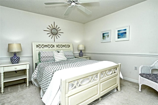 bedroom with light colored carpet and ceiling fan