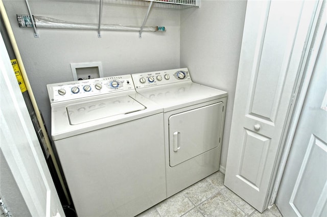 laundry area with washing machine and dryer