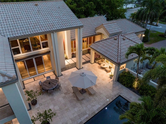 back of house with a gazebo and a patio area