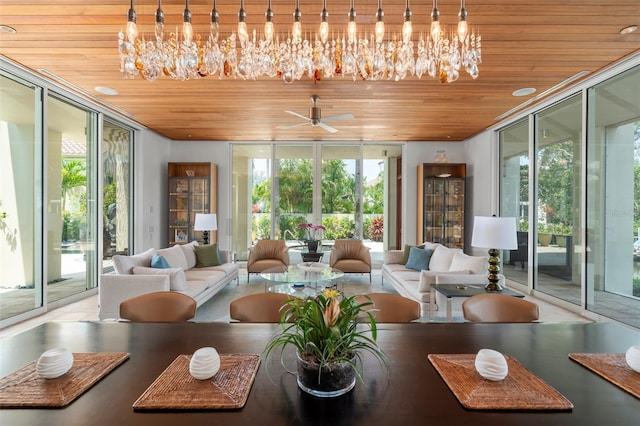 sunroom with wood ceiling, ceiling fan, and plenty of natural light