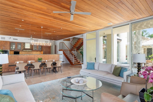 living room with expansive windows, light tile patterned floors, wooden ceiling, and ceiling fan