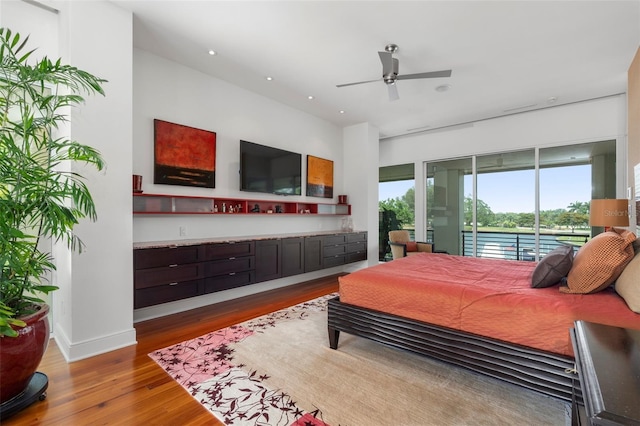 bedroom featuring hardwood / wood-style floors and access to exterior