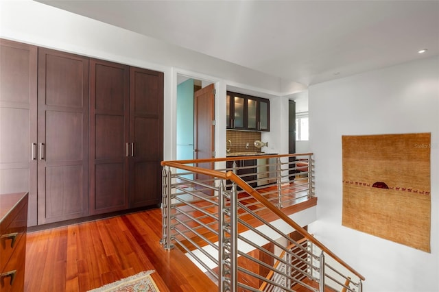 hall with dark hardwood / wood-style flooring