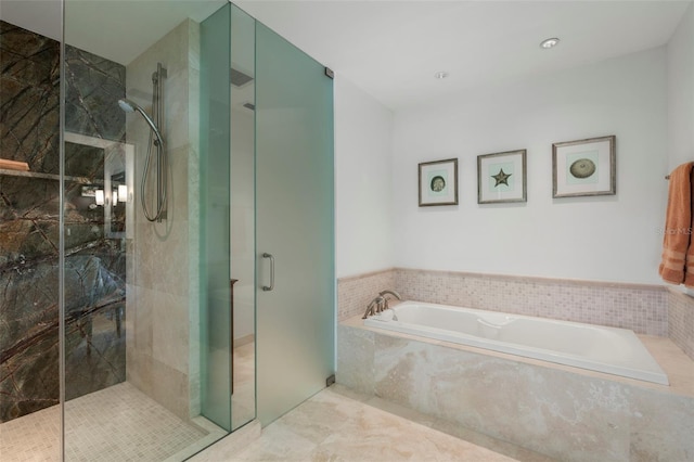 bathroom with shower with separate bathtub