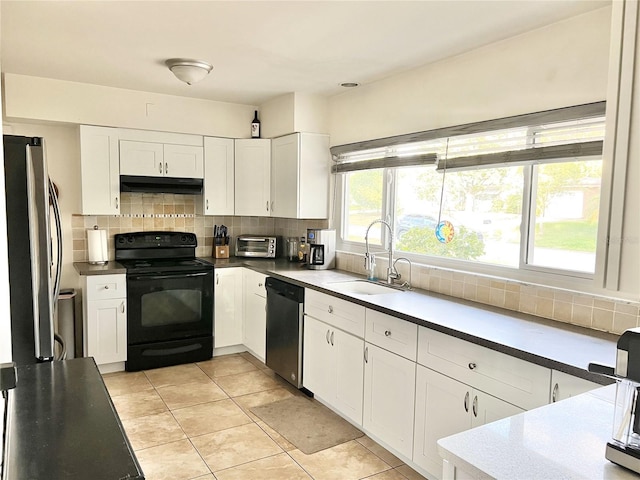 kitchen with sink, backsplash, stainless steel appliances, and white cabinets