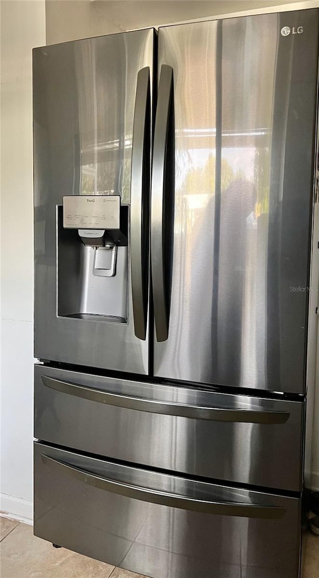 room details featuring stainless steel fridge