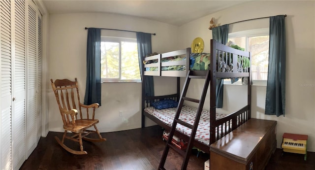 bedroom featuring dark hardwood / wood-style floors and a closet