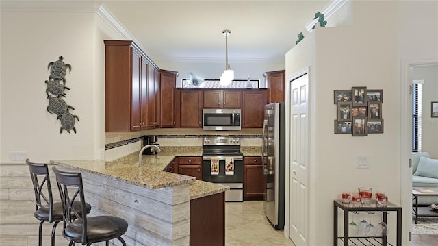 kitchen with decorative light fixtures, a breakfast bar area, light stone counters, kitchen peninsula, and stainless steel appliances