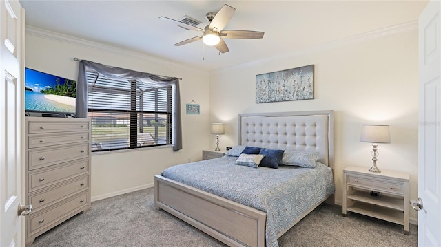 carpeted bedroom with ornamental molding and ceiling fan