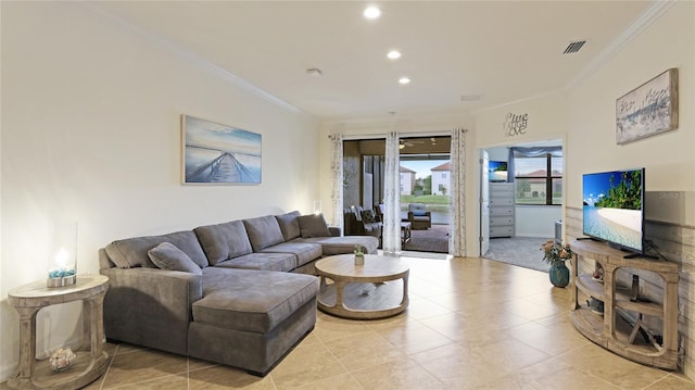 tiled living room featuring crown molding