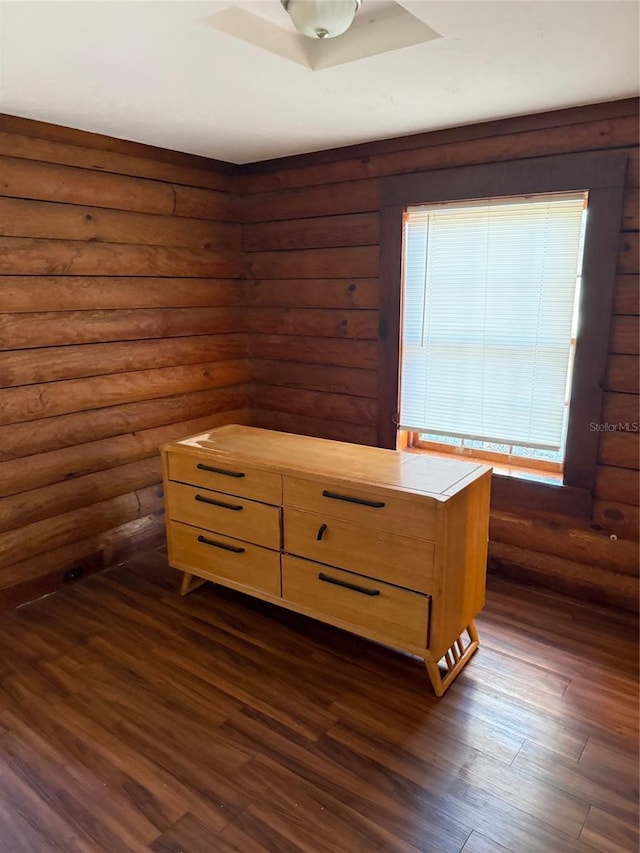 unfurnished bedroom featuring dark hardwood / wood-style floors