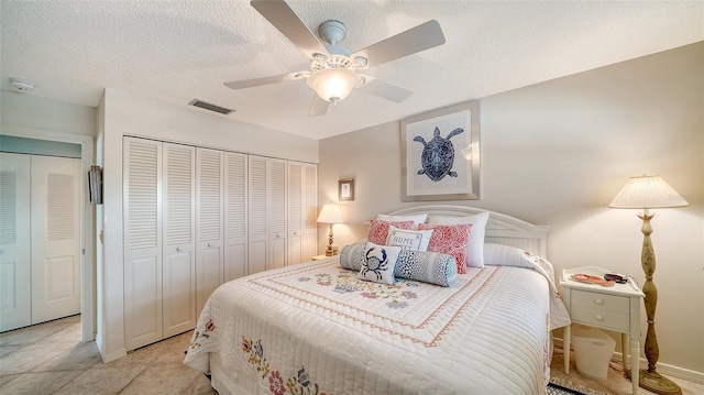 bedroom featuring ceiling fan and a textured ceiling