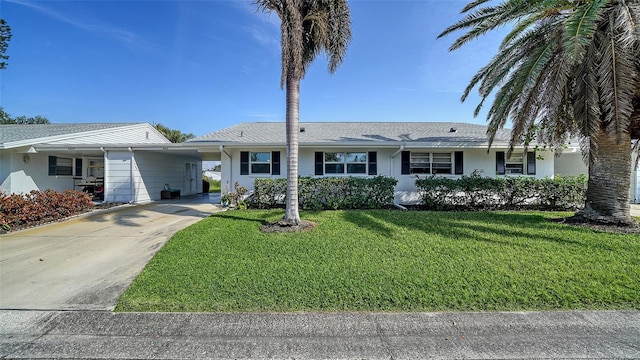 ranch-style home featuring a carport and a front yard