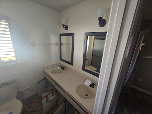 bathroom with vanity and toilet