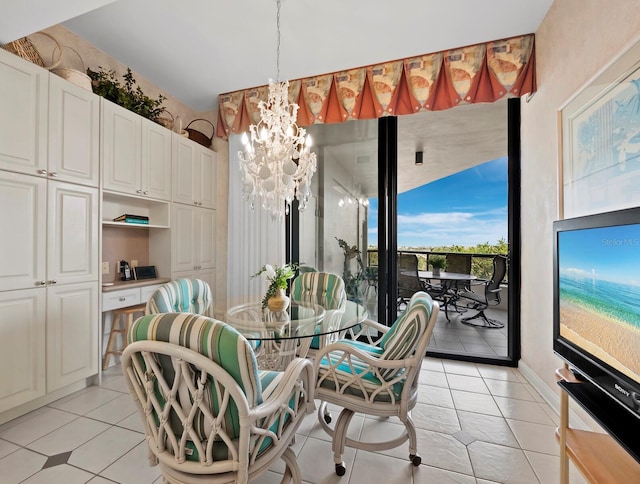 dining space featuring light tile patterned flooring and a chandelier