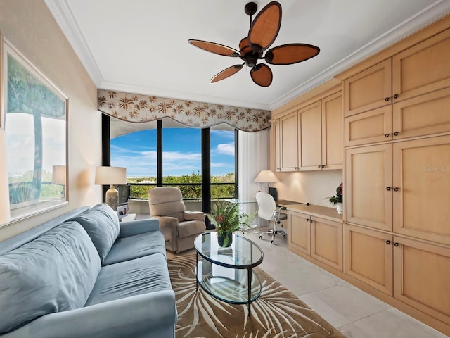 tiled living room with built in desk, ornamental molding, and ceiling fan