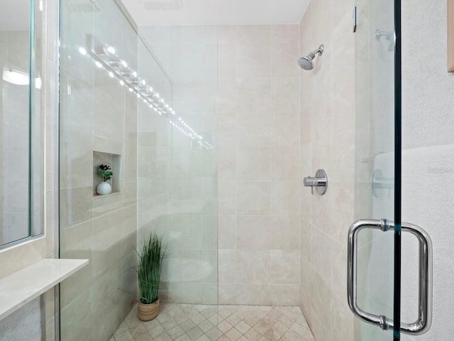 bathroom with a shower with shower door