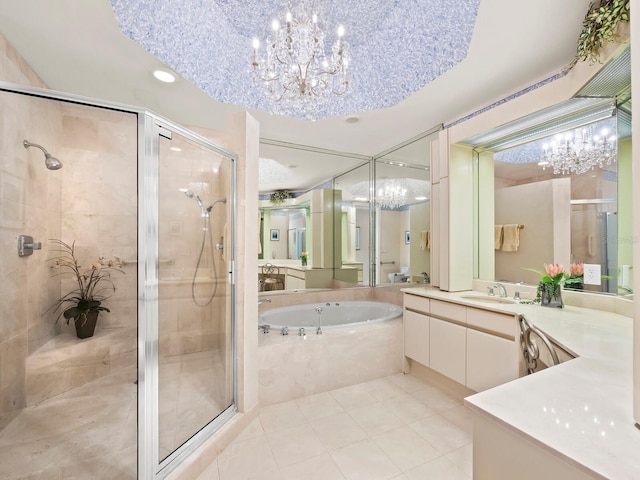 bathroom featuring a chandelier, tile patterned floors, vanity, and independent shower and bath