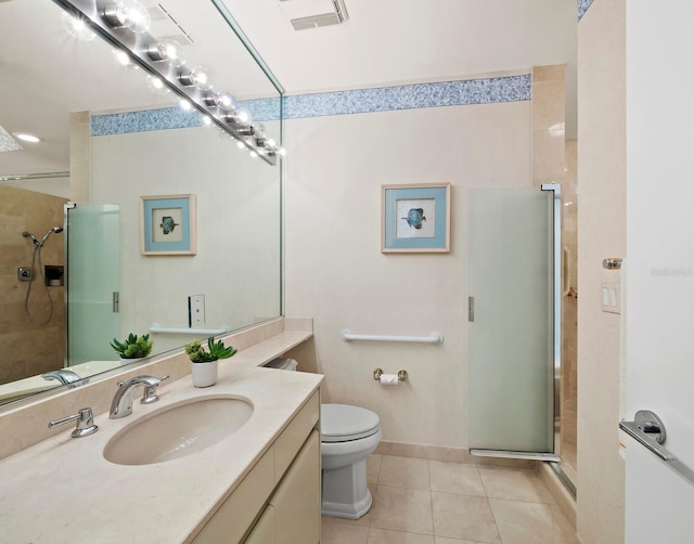 bathroom with vanity, an enclosed shower, tile patterned floors, and toilet