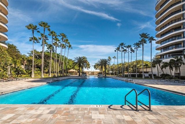 view of swimming pool featuring a patio area