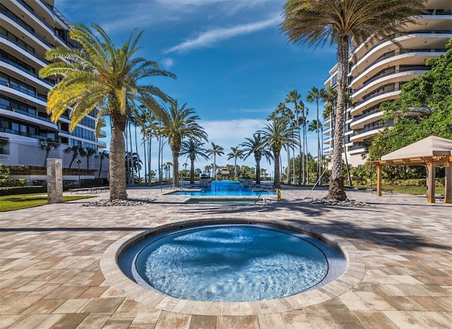 view of pool with a gazebo and a community hot tub