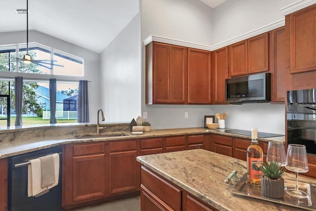 kitchen with black appliances, lofted ceiling, sink, light stone counters, and ceiling fan