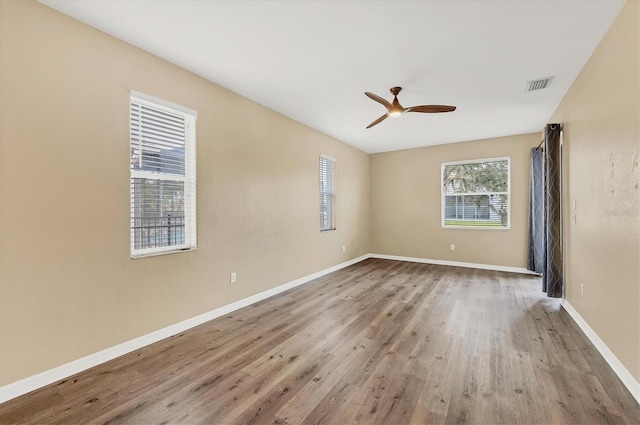 unfurnished room featuring ceiling fan and light wood-type flooring