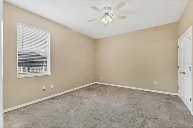 empty room featuring ceiling fan and carpet floors