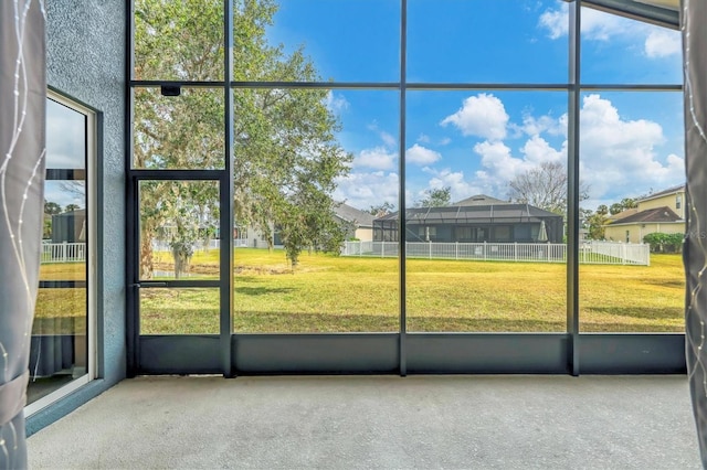 unfurnished sunroom featuring plenty of natural light