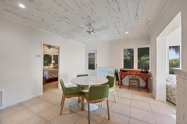 tiled dining room featuring wooden ceiling and ceiling fan