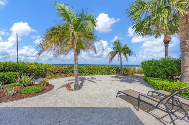 view of patio with a water view