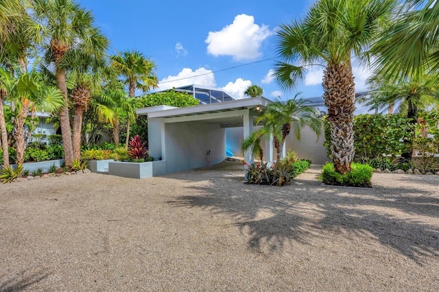 view of property exterior featuring a carport