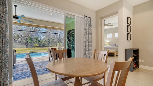 dining room featuring light tile patterned floors and ceiling fan