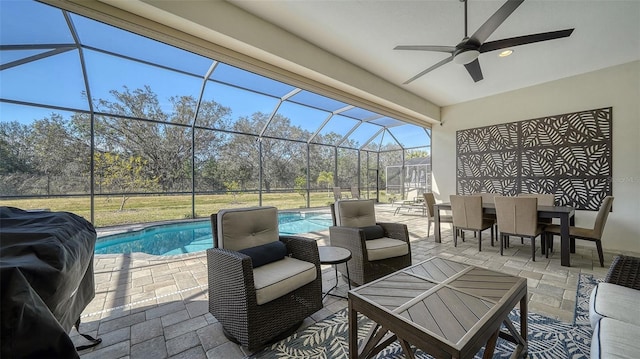 view of patio / terrace with ceiling fan, a lanai, and an outdoor hangout area