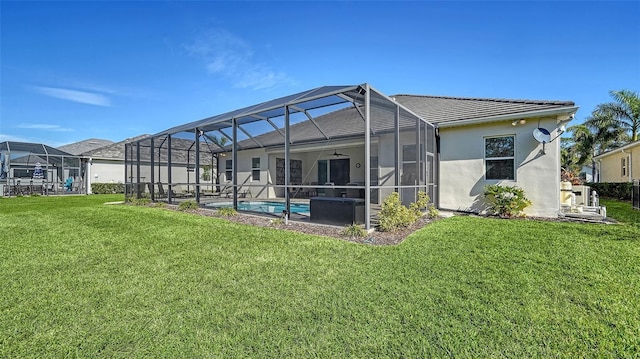 back of property featuring a patio, glass enclosure, and a lawn