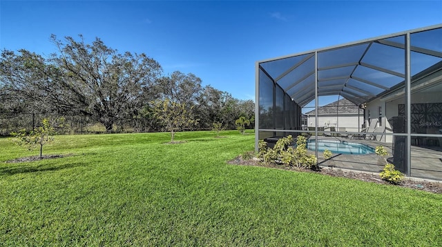 view of yard featuring glass enclosure