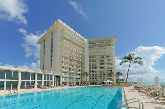 view of swimming pool featuring a patio area