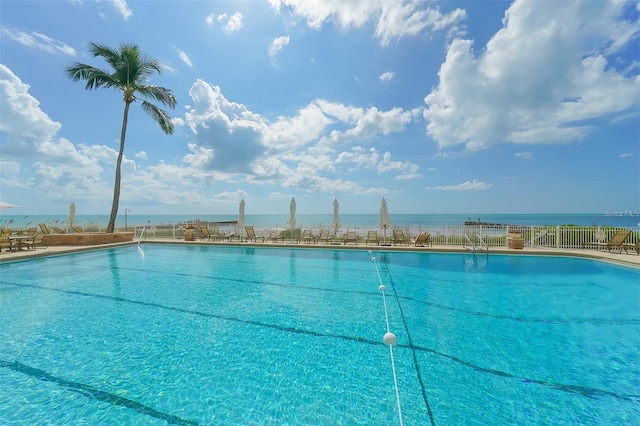 view of pool featuring a water view