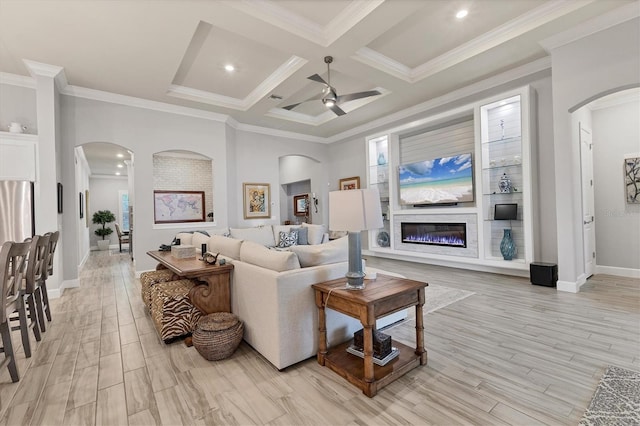 living room featuring crown molding, ceiling fan, coffered ceiling, and light hardwood / wood-style floors