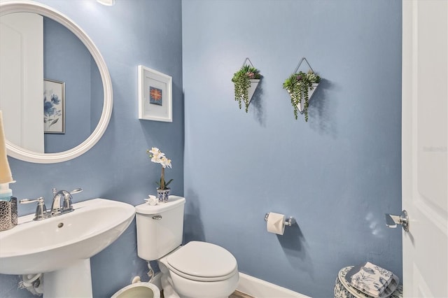 bathroom with toilet and sink