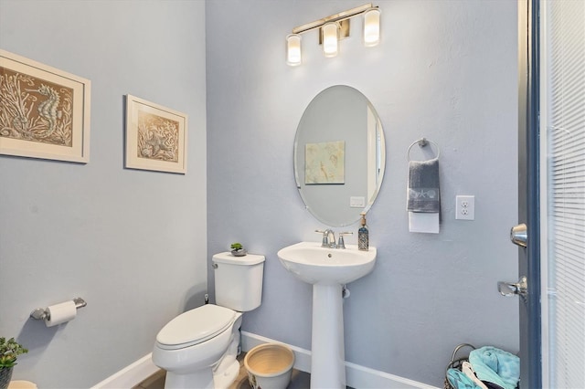 bathroom with sink and toilet