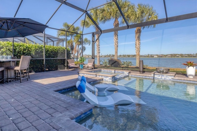 view of pool featuring a bar, an in ground hot tub, glass enclosure, a water view, and a patio area