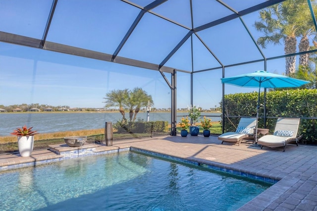 view of swimming pool with a water view, a patio, and glass enclosure