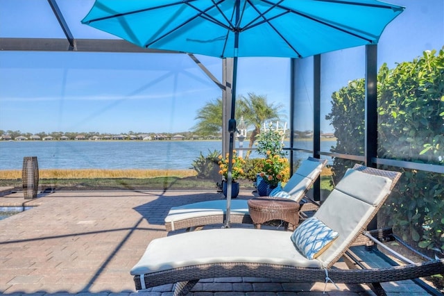 view of patio with a water view