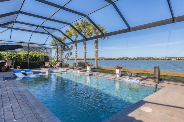 view of pool featuring an in ground hot tub, a water view, glass enclosure, and a patio