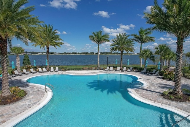 view of pool with a water view